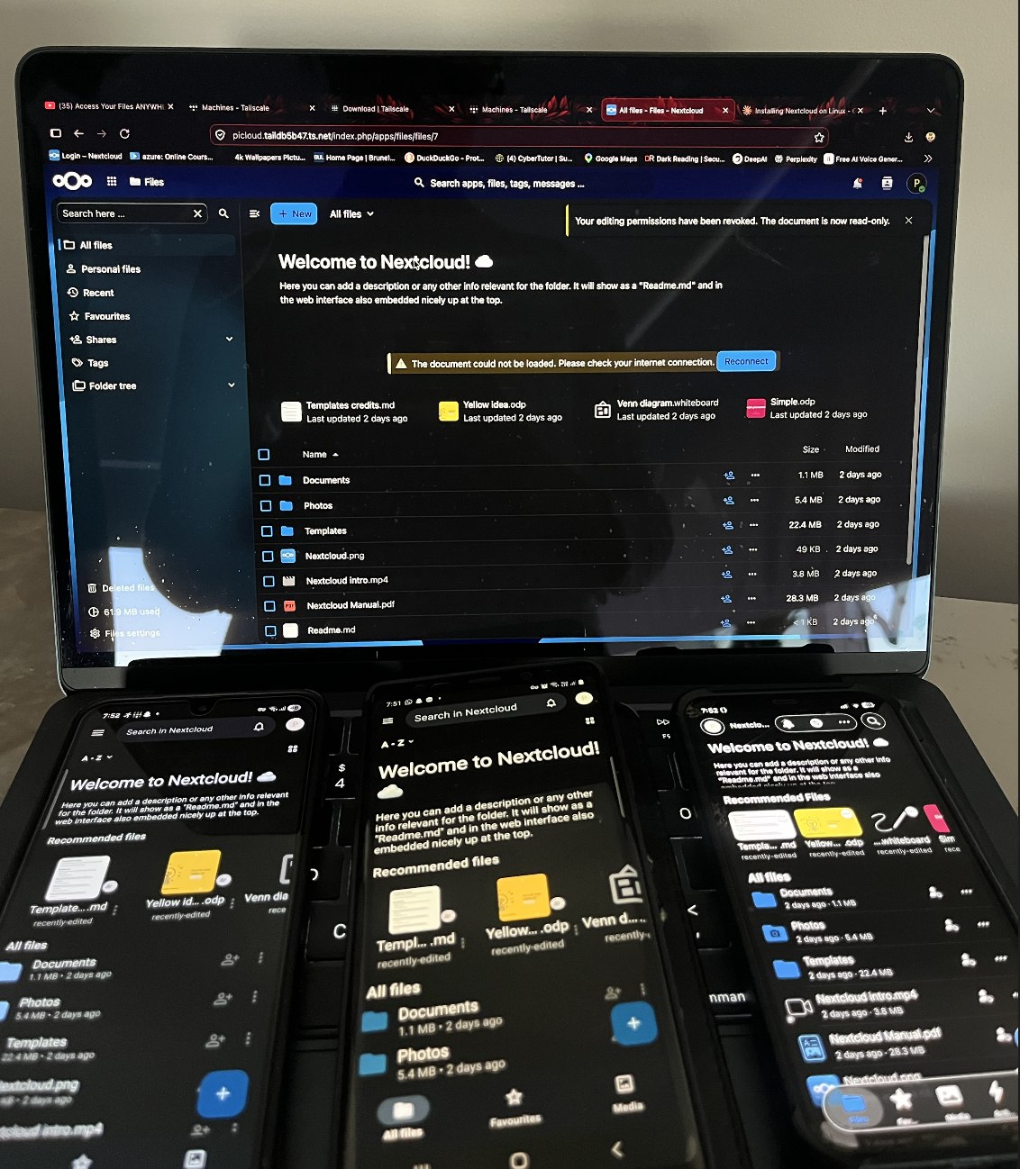 Laptop and three phones all signed into the same Nextcloud account simultaneously, showing the file browser in sync across every device