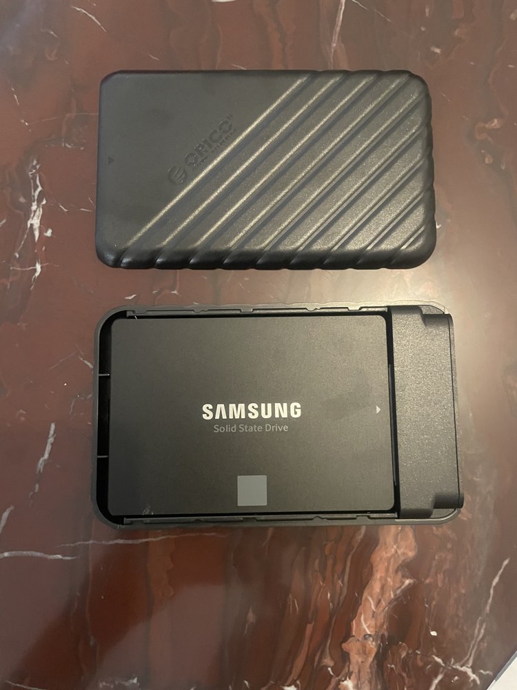 Samsung SSD seated into the open ORICO enclosure tray, ready to be closed up