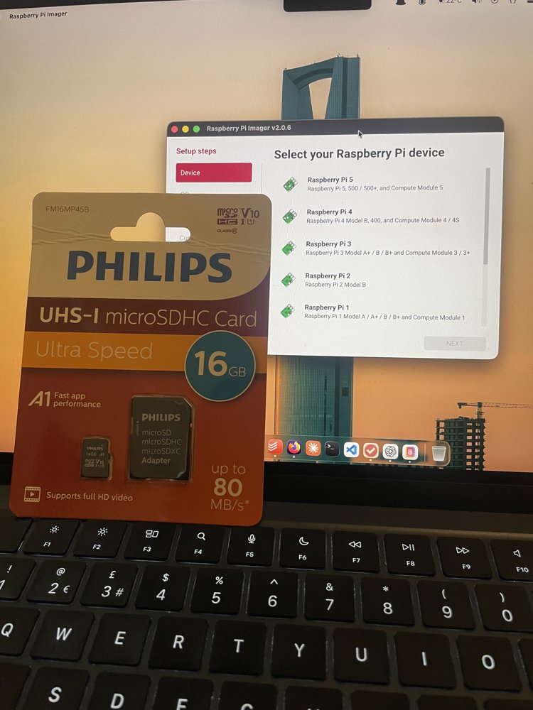 Raspberry Pi Imager open on a laptop with the Philips 16GB microSD card in front of the keyboard, on the "Select your Raspberry Pi device" step