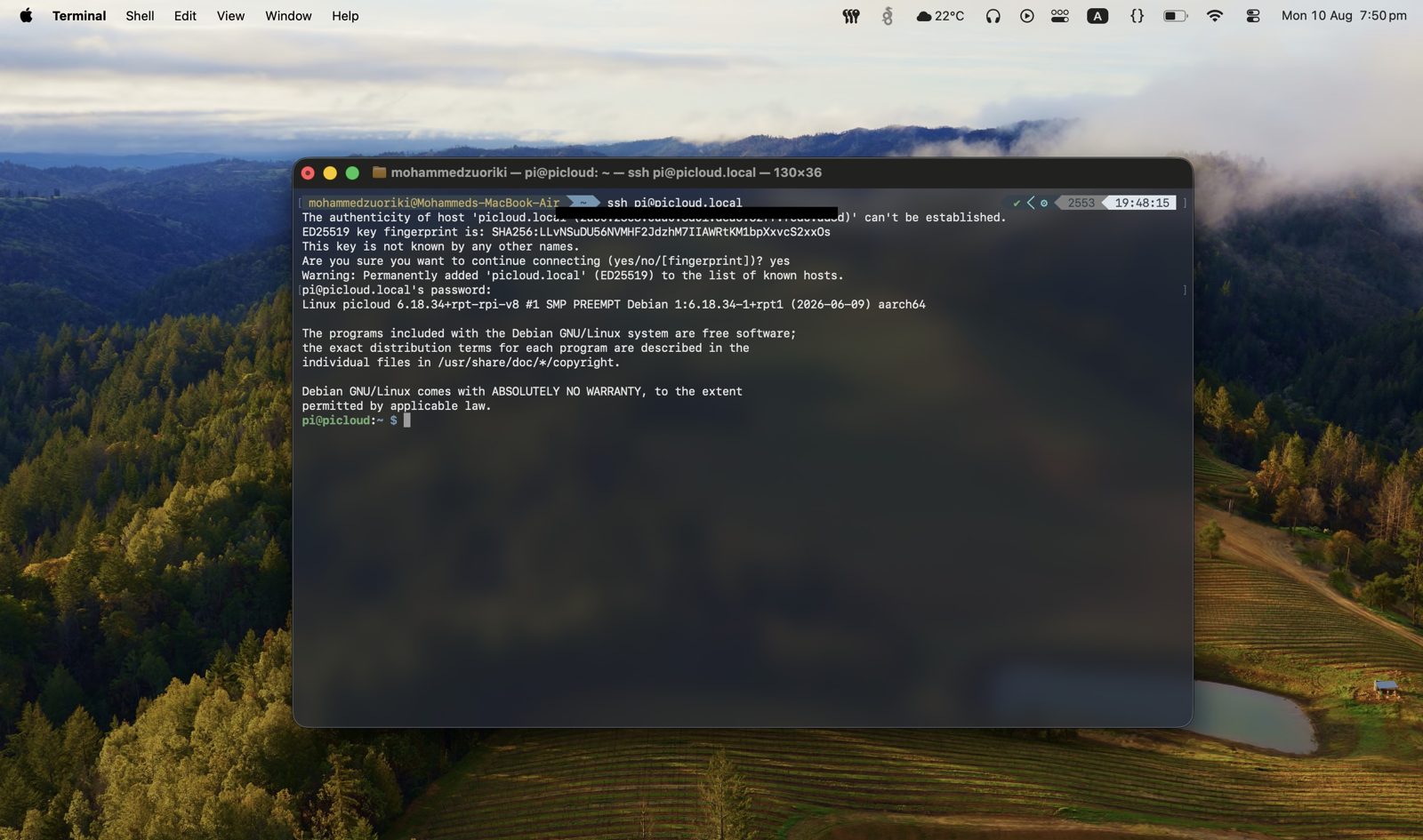 Terminal showing the first SSH connection to pi@picloud.local, accepting the host key fingerprint and logging into Debian on the Pi